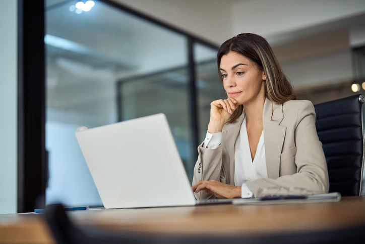 A financial advisor balancing a client's portfolio after reviewing cyclical and non-cyclical stocks.